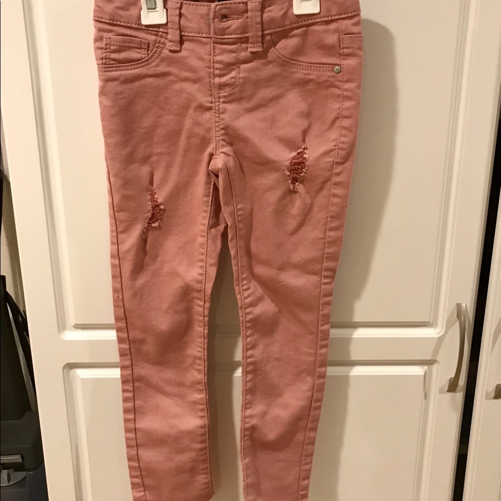 Pink jeans with stylish rips/tears never worn